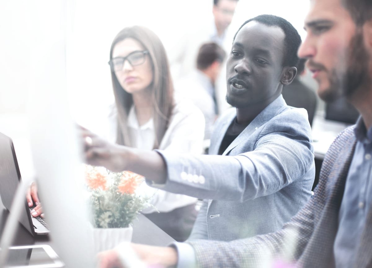 Enterprise delivery team reviewing outcomes